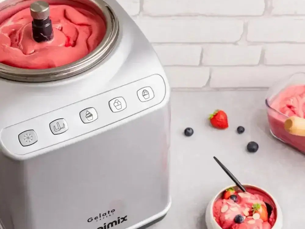 Strawberry gelato churning in a Magimix Gelato Expert with bowls of sorbet alongside