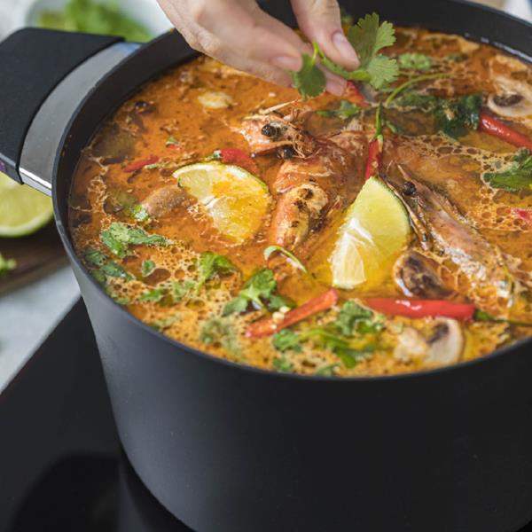 Stock pot with cooked seafood curry
