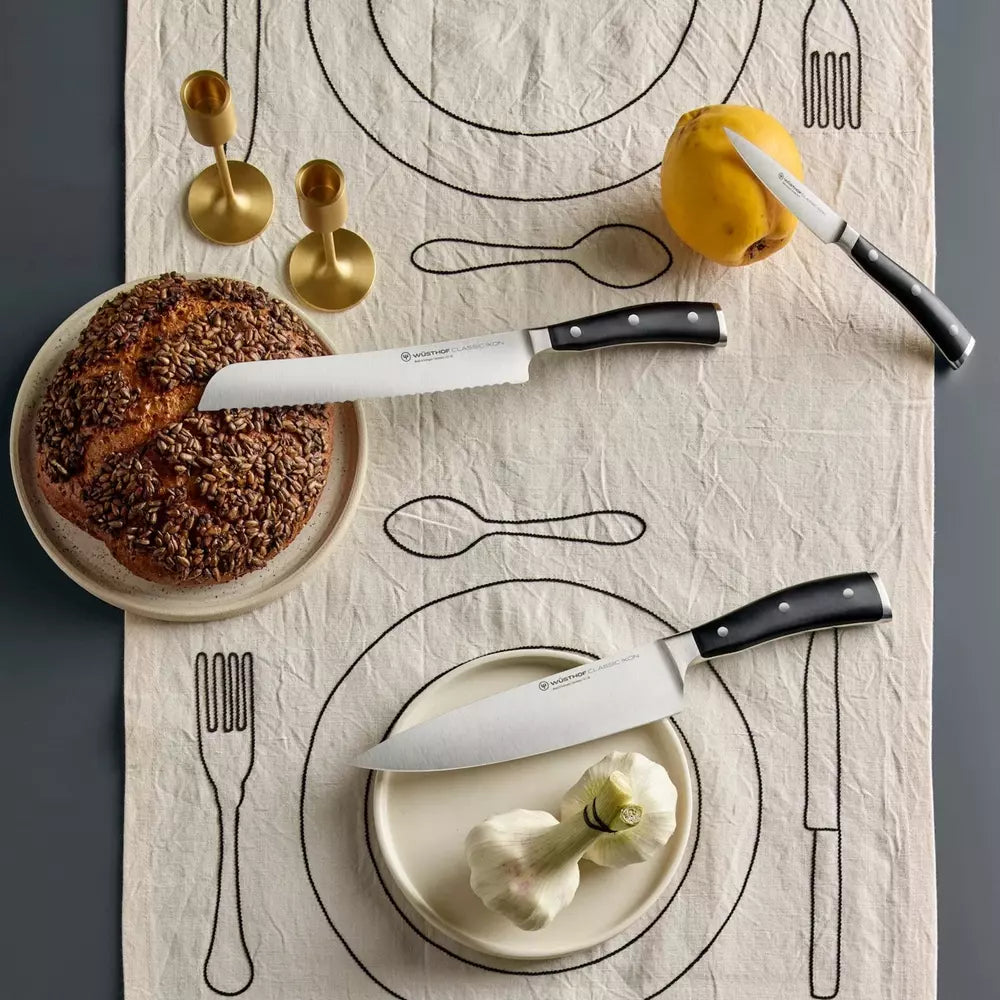 Assorted premium kitchen knives from Cookin Stores on a white background