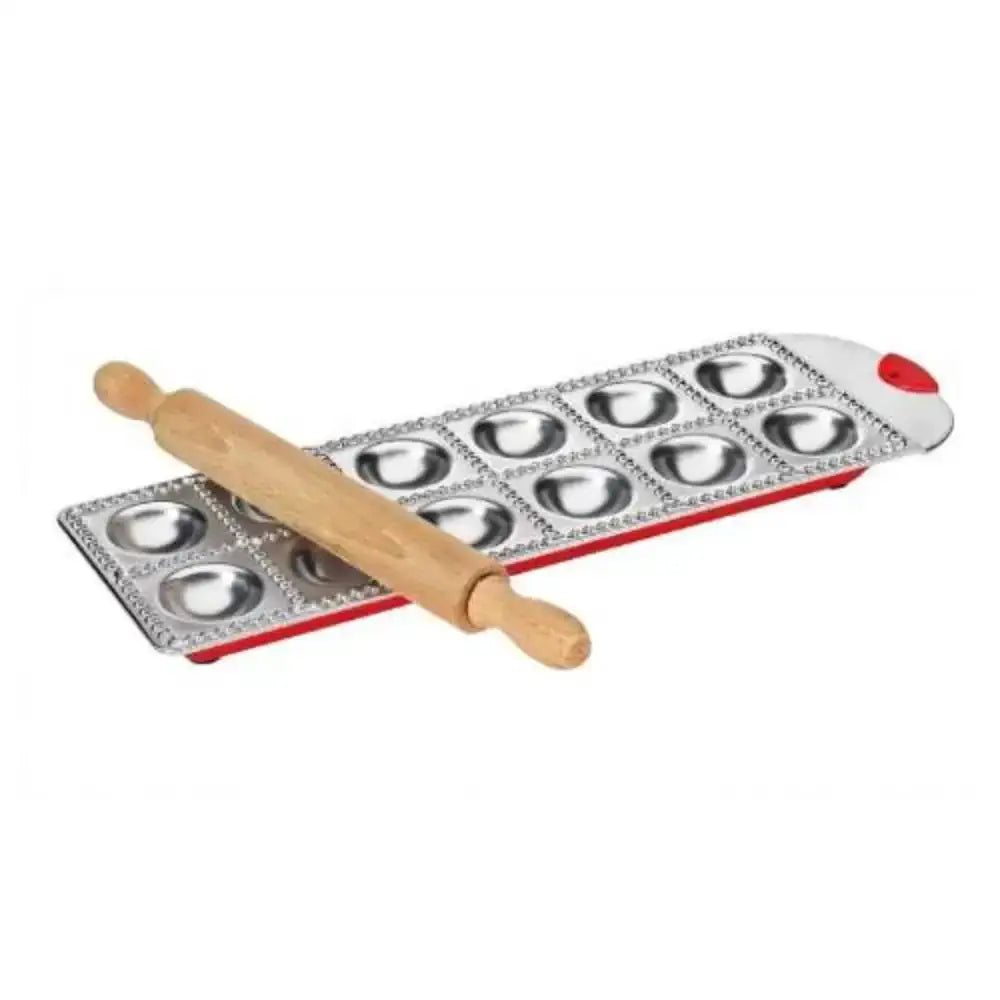 Ravioli tray and a wooden rolling pin on a white background