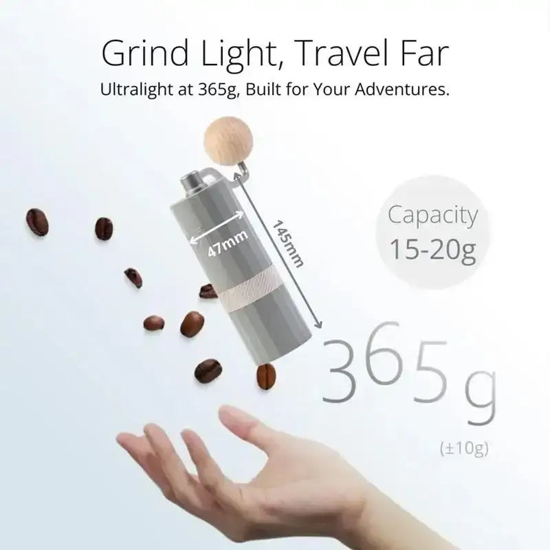 1Zpresso Q Air manual coffee grinder with measurements, coffee beans, and hand, Cookin Stores kitchenware