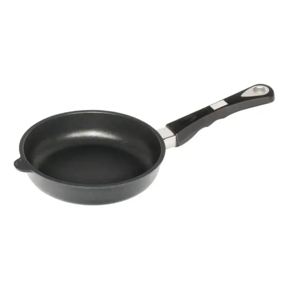 Black frying pan with a handle on a white background