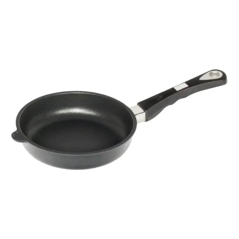 Black frying pan with a handle on a white background