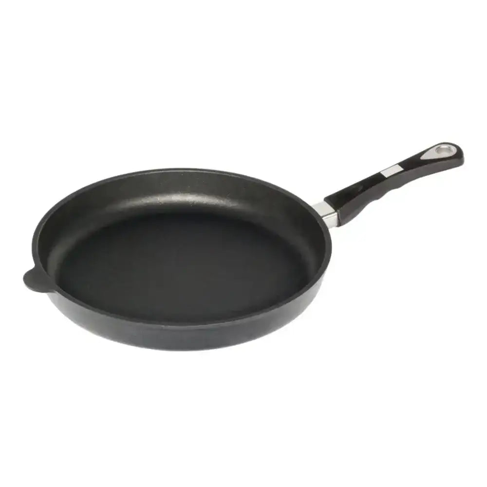 Black frying pan with a handle on a white background