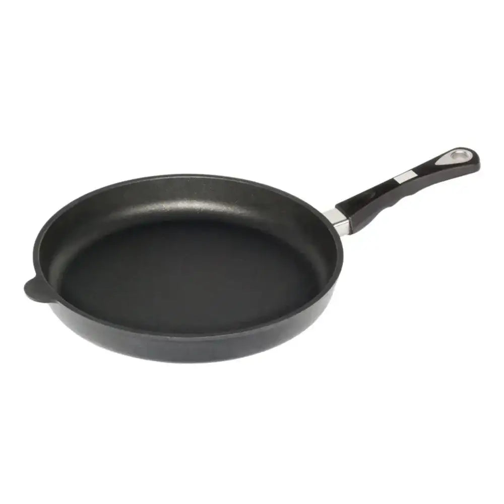 Black frying pan with a handle on a white background