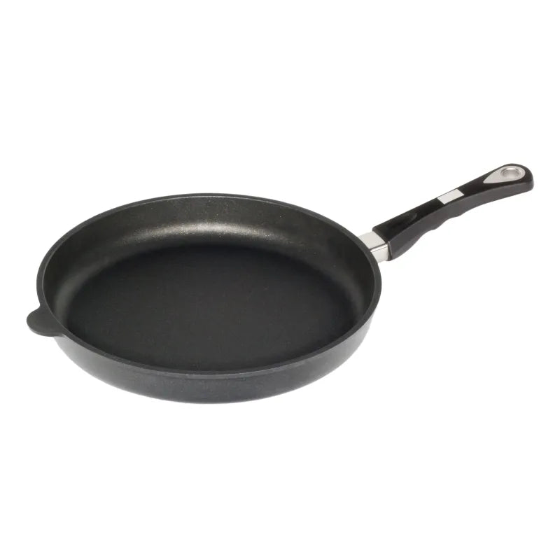 Black frying pan with a handle on a white background