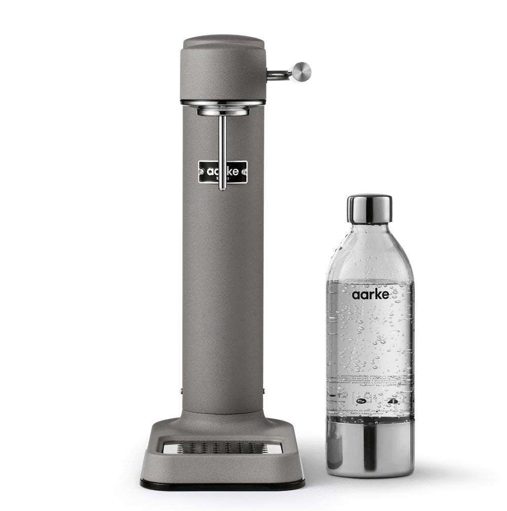 Aarke water carbonator with a clear Aarke water bottle on a white background