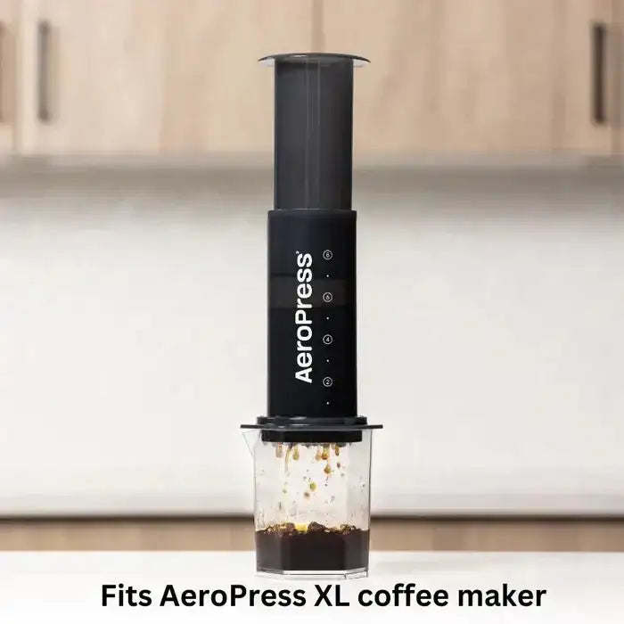 AeroPress XL coffee maker on a kitchen counter with a blurred background