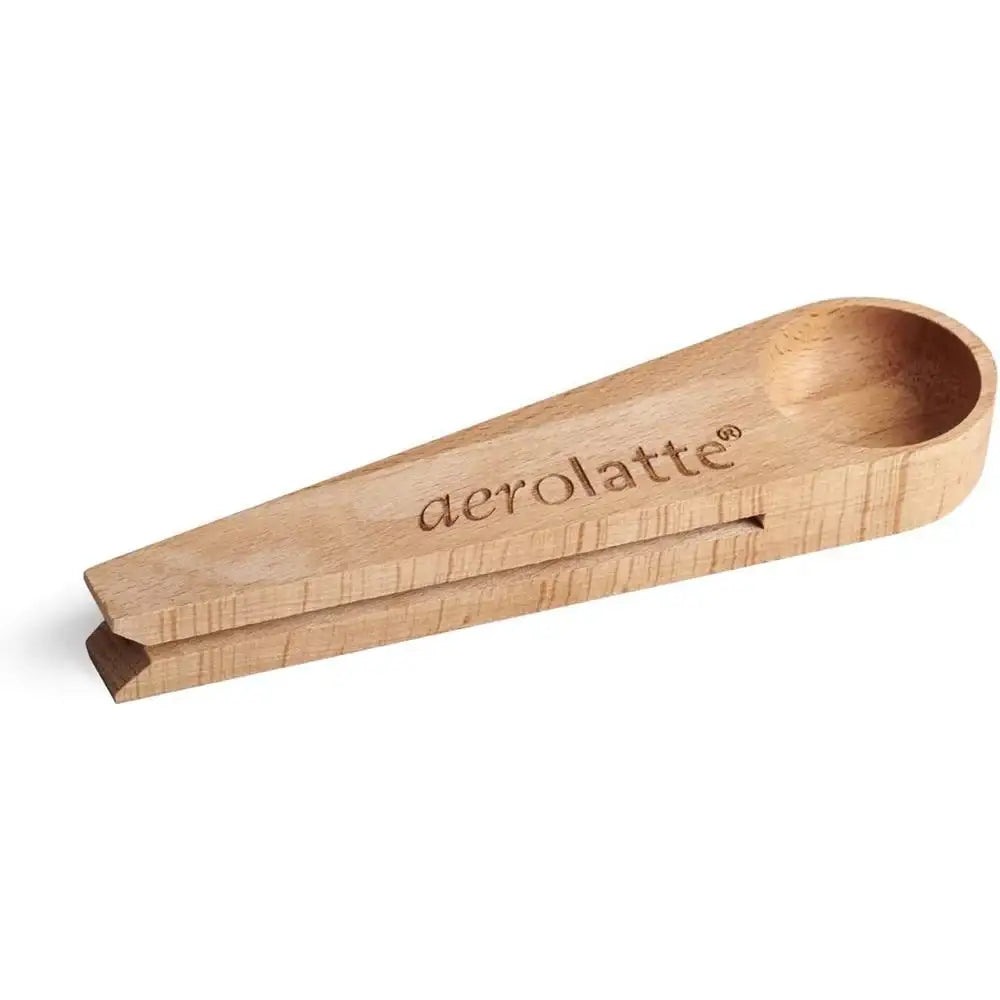 Wooden scoop with 'aerolatte' branding on a white background