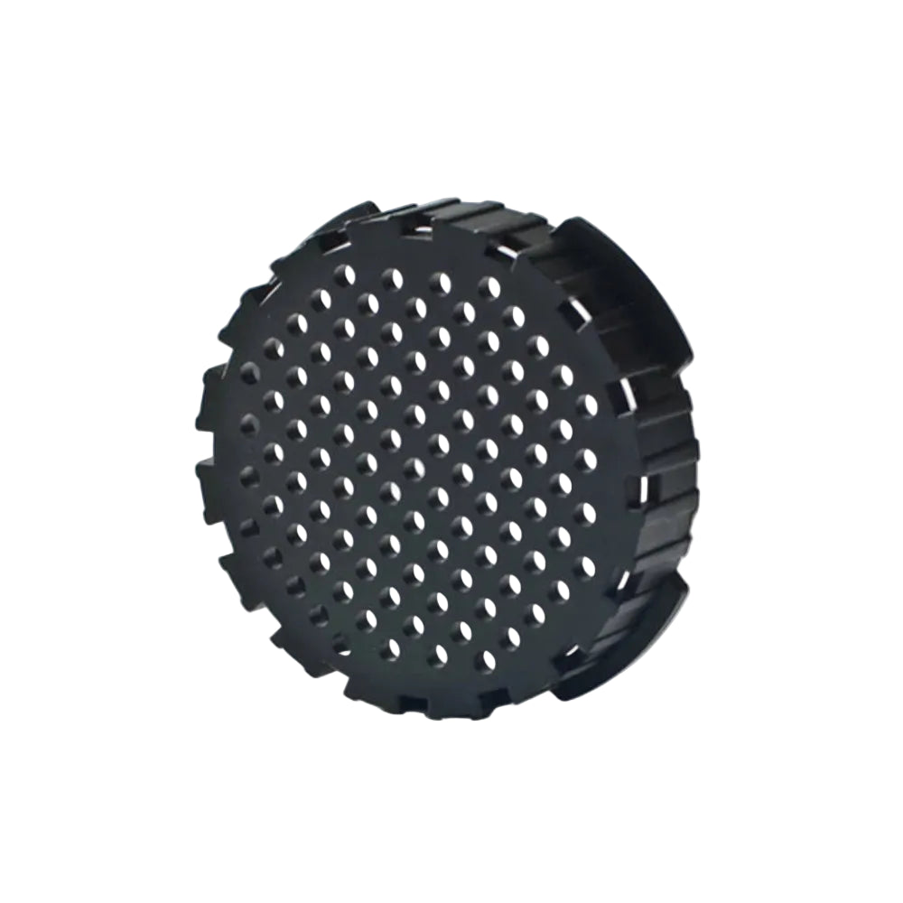 Black perforated circular replacement filter cap for Aeropress Coffee Maker on white background