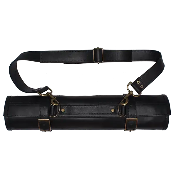 Black leather tool roll with brass hardware on a white background