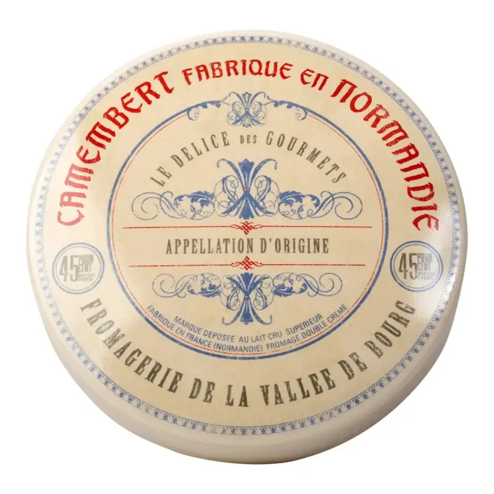 Camembert cheese wheel with decorative label on a white background