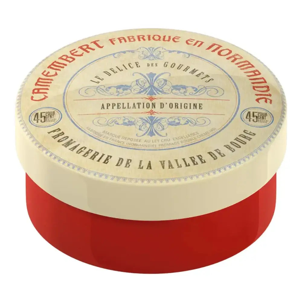 Round Camembert cheese with red base and decorative label on a white background