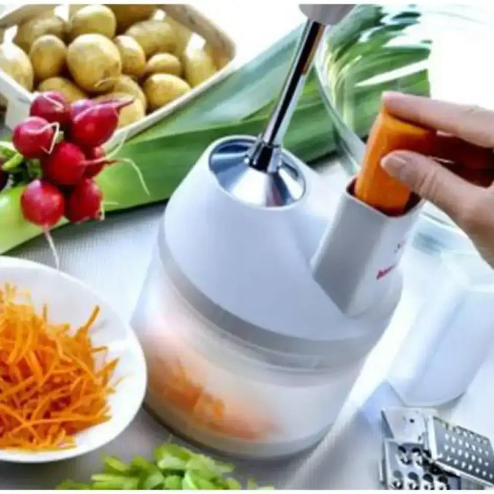 Vegetable peeler being used on a carrot with vegetables and potatoes in the background