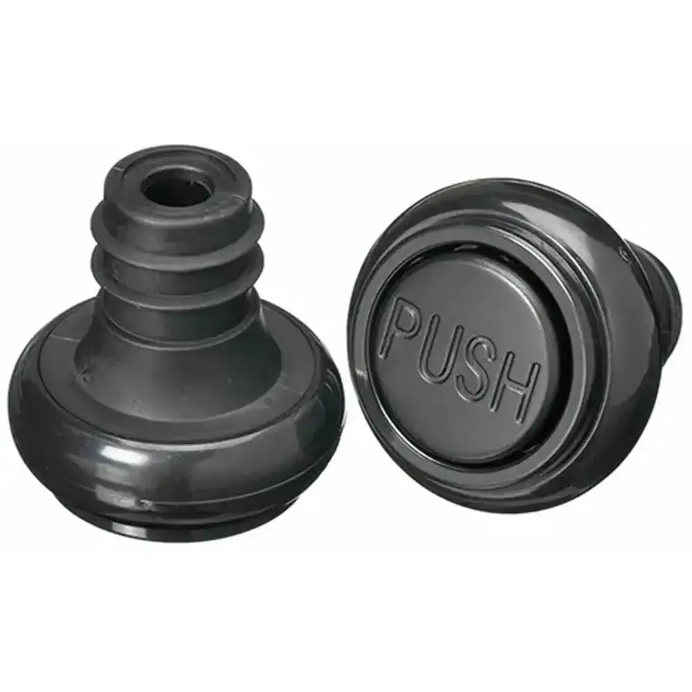 Black wine bottle stoppers with 'PUSH' text on a white background