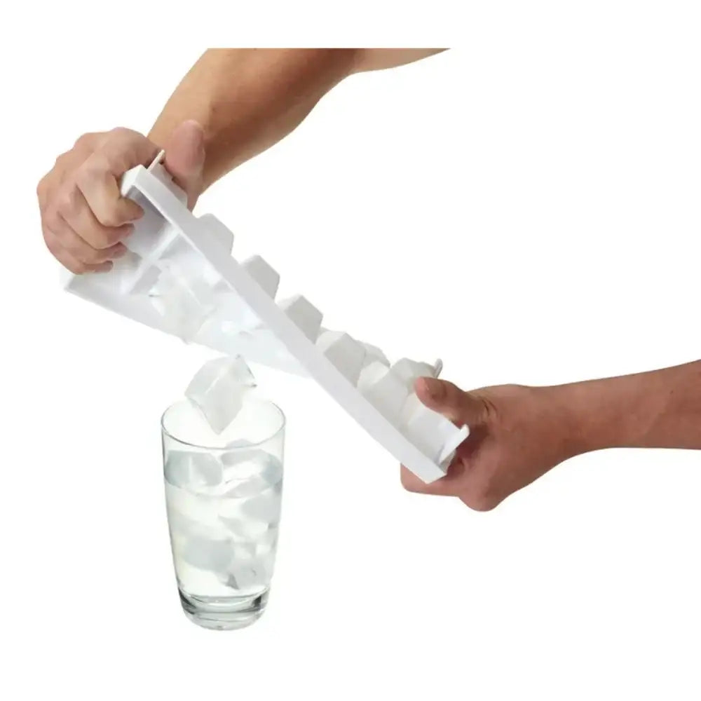 Person using a white ice cube tray to fill a glass with water.