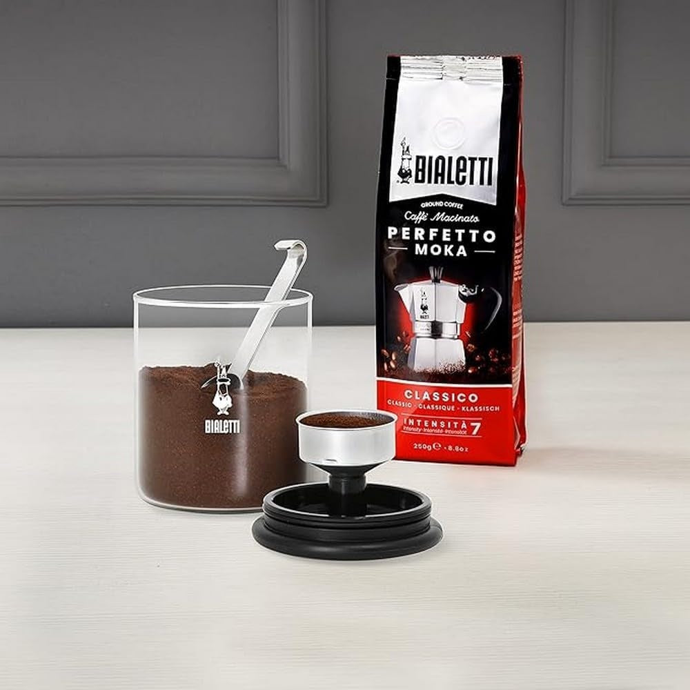 Bialetti coffee maker with a bag of Bialetti coffee on a gray surface