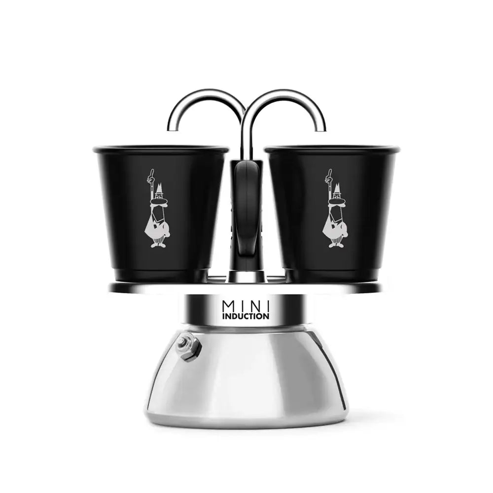 Mini induction coffee maker with two black cups on a white background