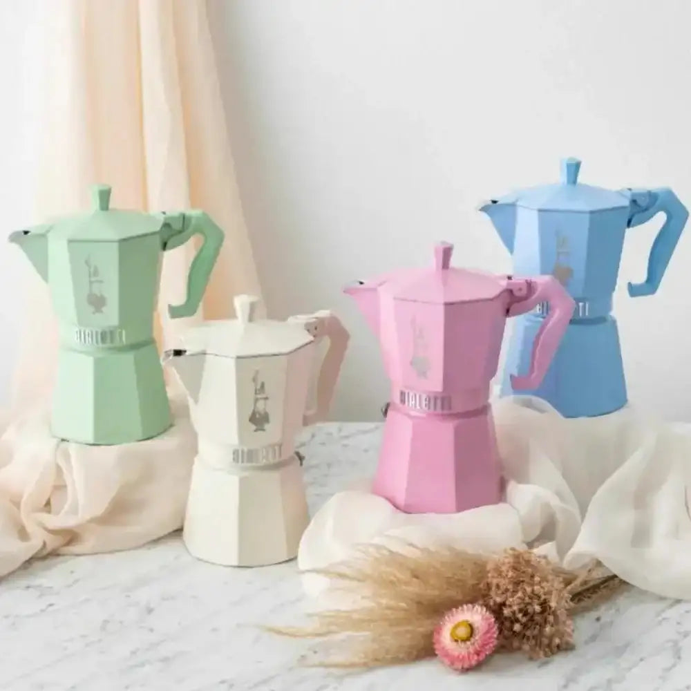 Set of colorful coffee makers on a neutral background