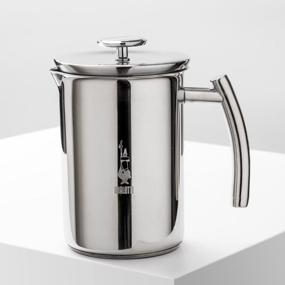 Stainless steel Bialetti milk frother on a clean white surface.