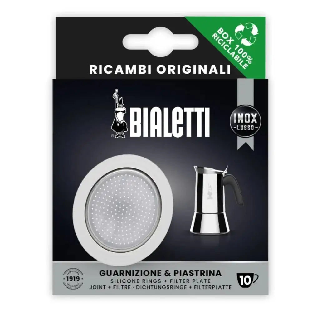 Bialetti coffee maker parts packaging with filter plate and silicone rings on a black background