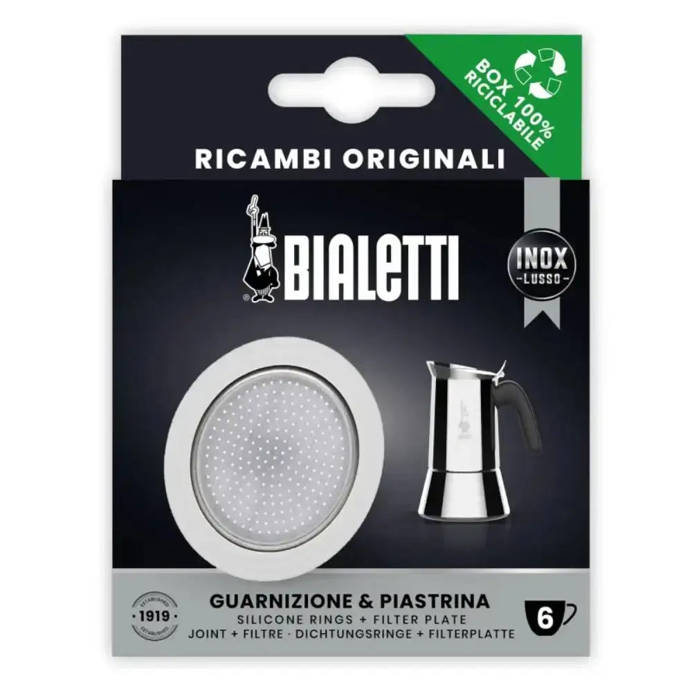 Bialetti coffee maker parts packaging with filter plate and moka pot illustration on a dark background.