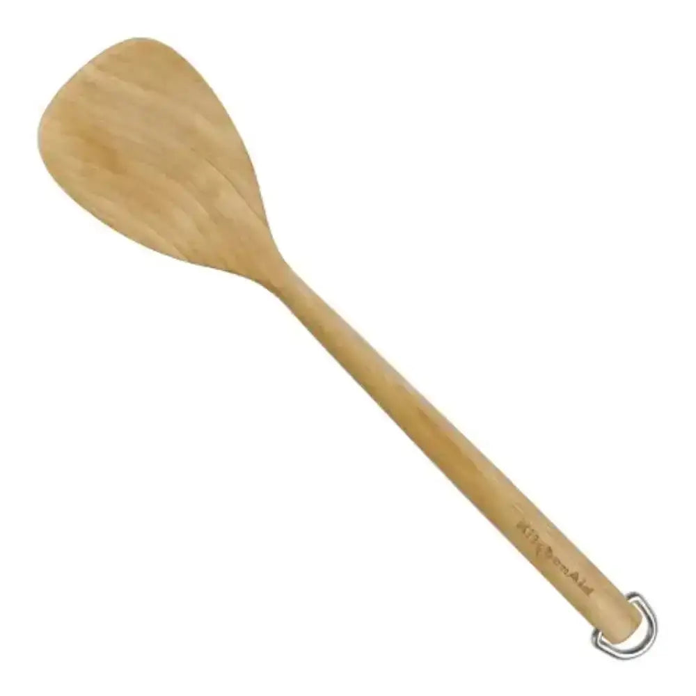 Wooden spatula with a ring handle on a white background