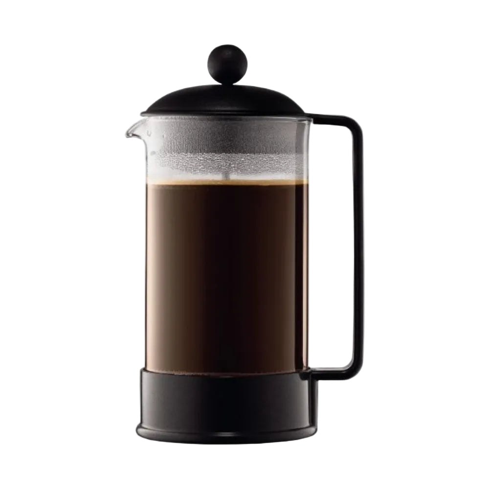 A classic French press coffee maker with a black metal body, handle, and lid, filled with dark coffee in a clear glass carafe, shown against a plain white background.