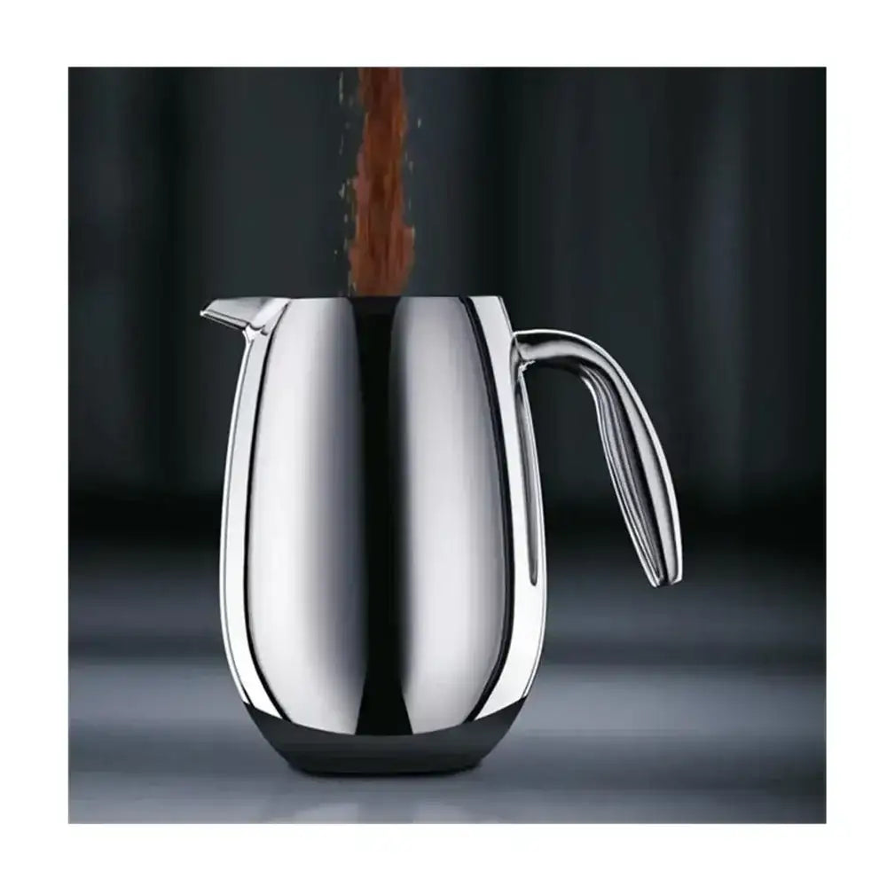 Silver french press with a dark background