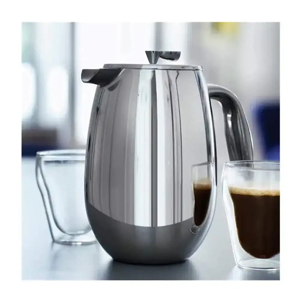 Stainless steel thermos carafe with two glasses of coffee on a blurred background