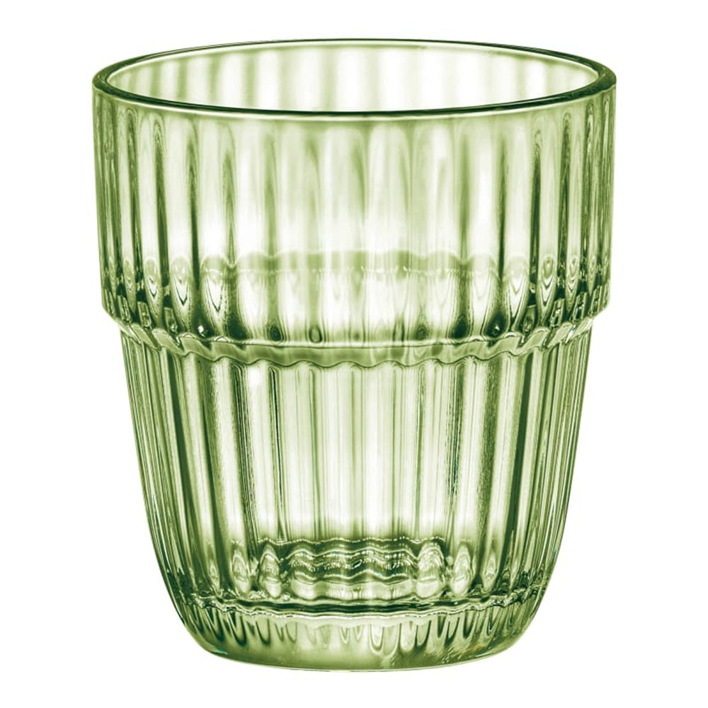 Green glass tumbler with ribbed texture on a white background