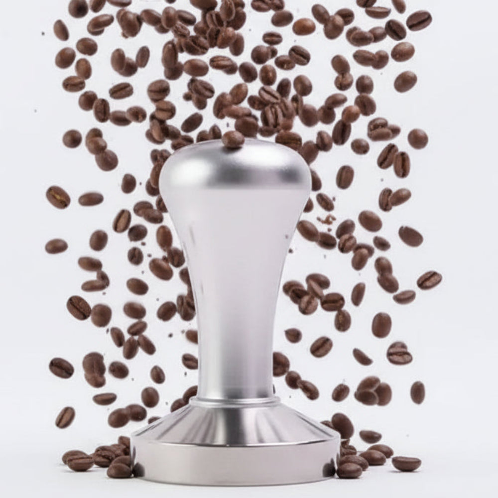 Metallic coffee tamp on a white background