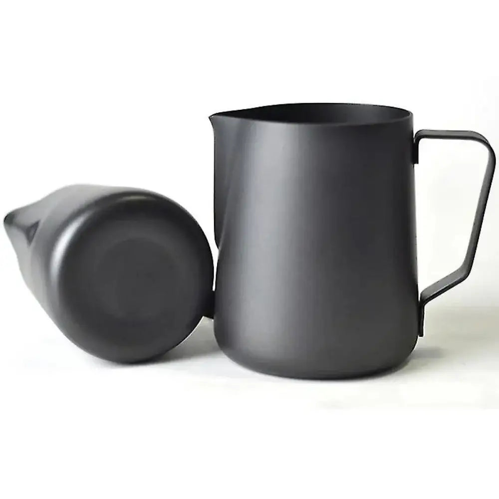Black milk frothing pitcher with a spout on a white background