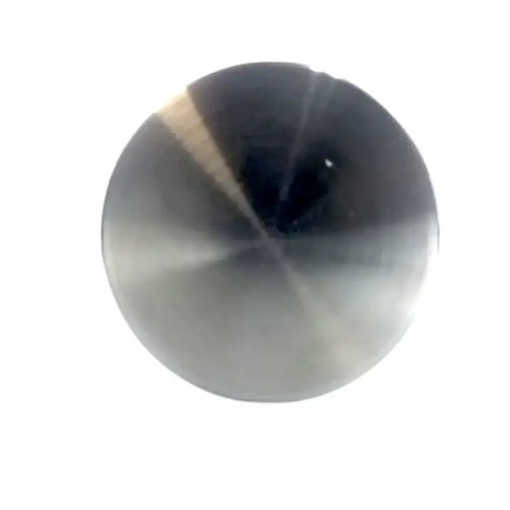 Round metallic object with a reflective surface on a white background