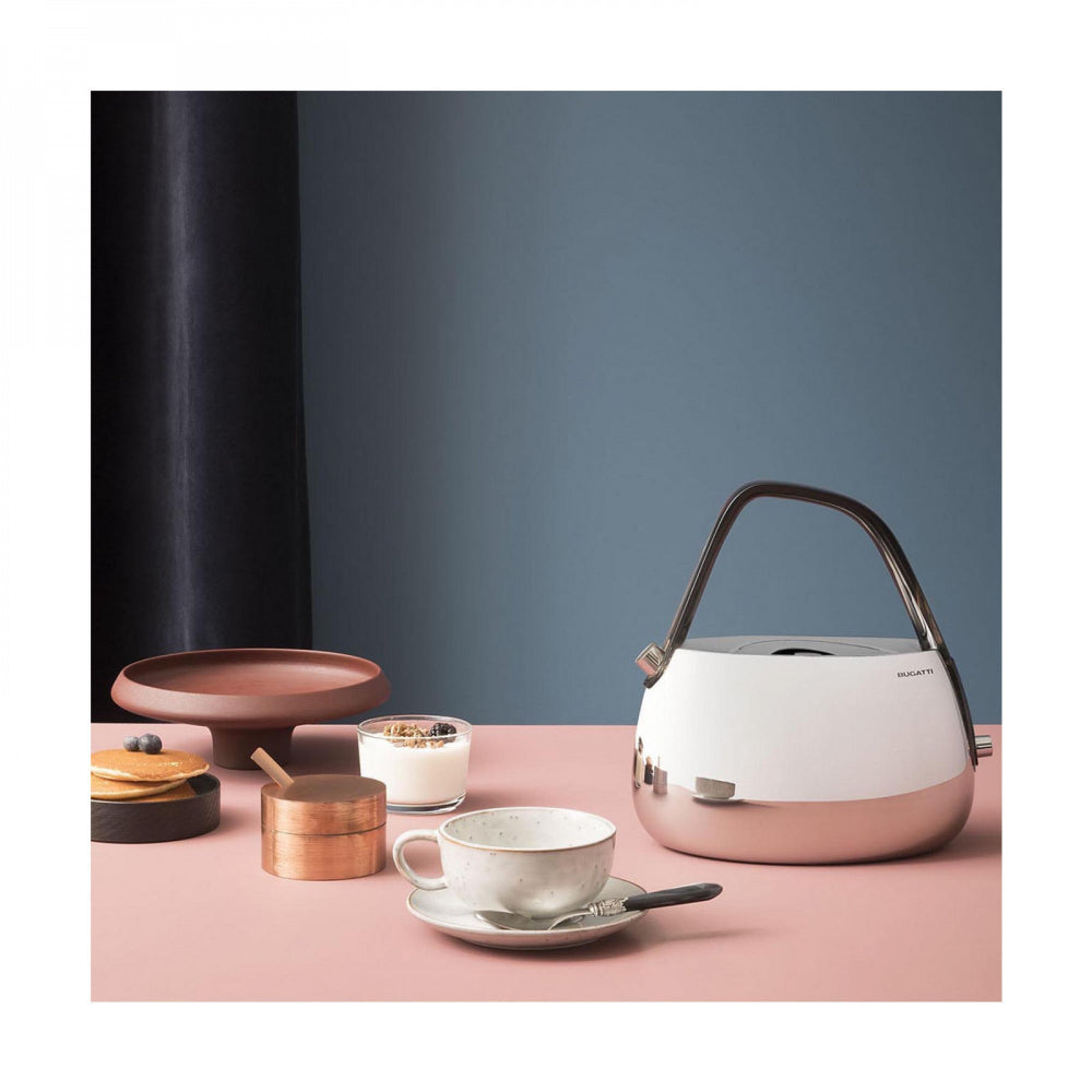 Silver kettle with coffee and pancakes on a pink surface 