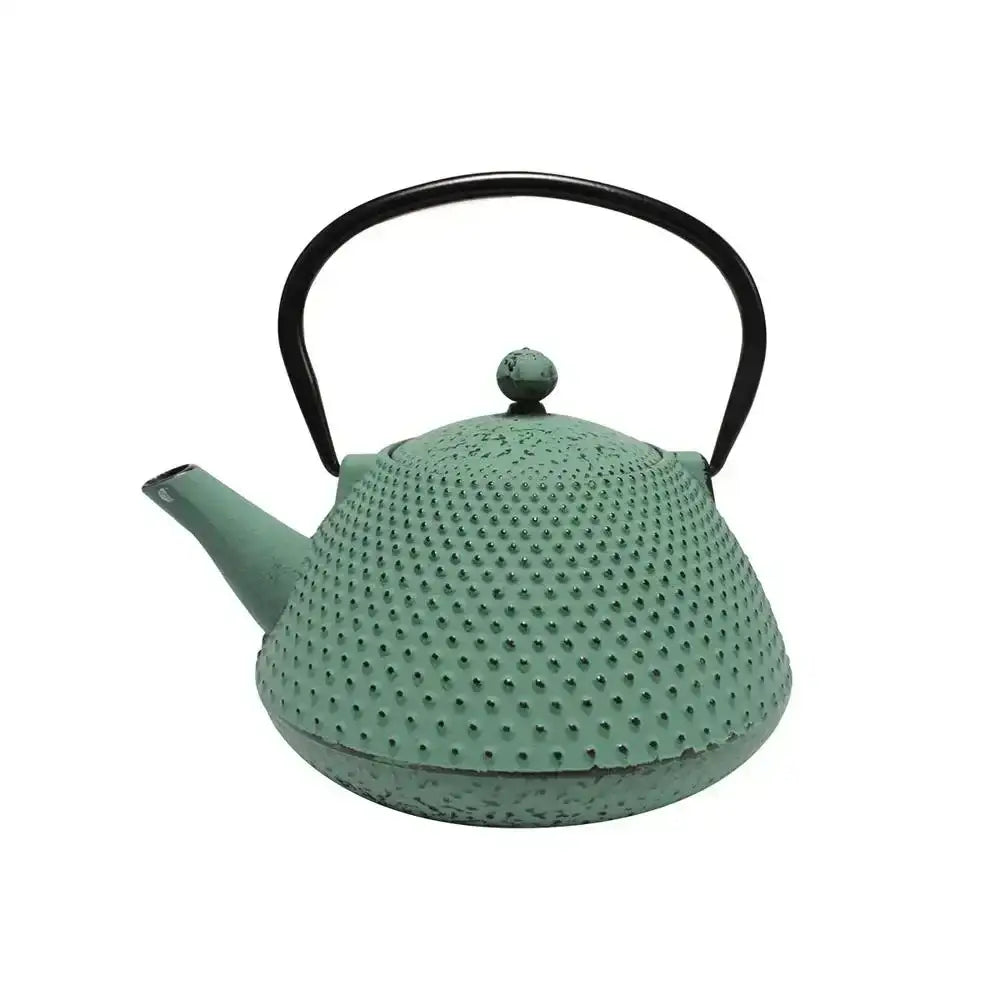 Teal textured teapot with black handle on a white background
