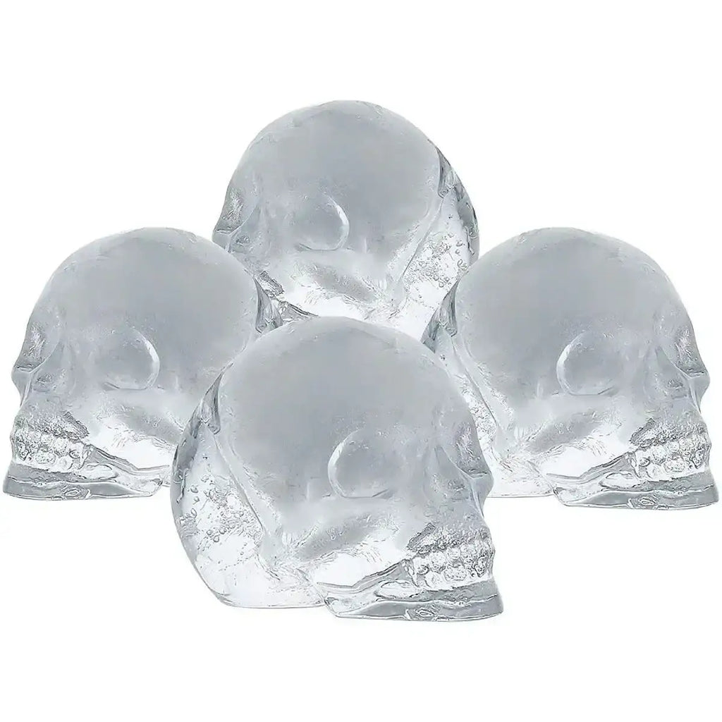 Four clear skull-shaped ice cubes, ideal for drinks, made with silicone tray from Cookin Stores