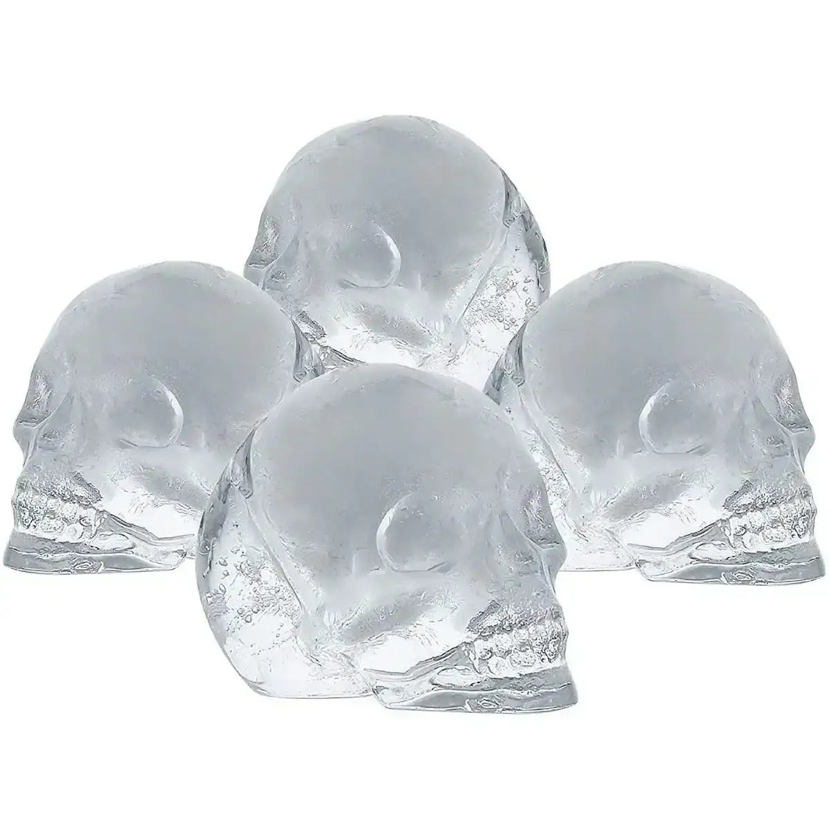 Four clear skull-shaped ice cubes, ideal for drinks, made with silicone tray from Cookin Stores