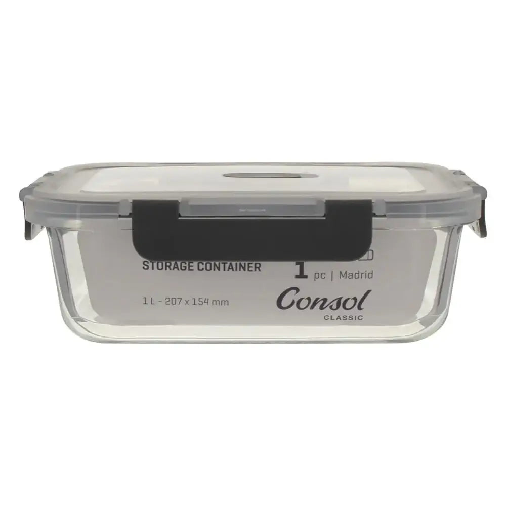 Clear glass storage container with black lid on a white background