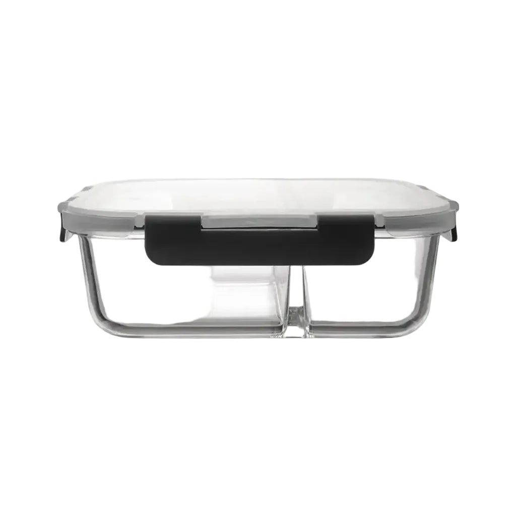 Clear glass food storage container with a black lid on a white background