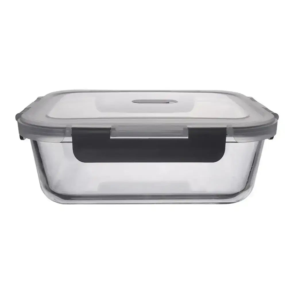 Clear glass food storage container with a black lid on a white background