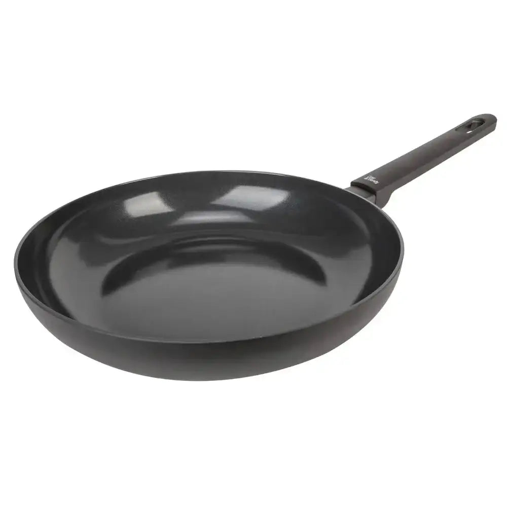 Black frying pan on a white background