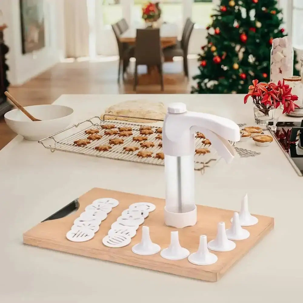 Biscuit cutter set on a wooden board with Christmas decorations in the background