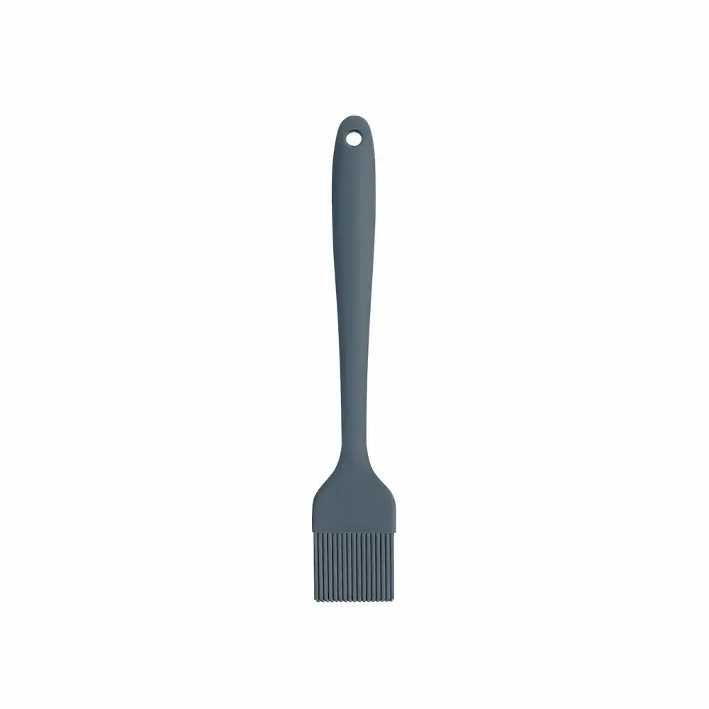 Gray silicone brush with a handle on a white background