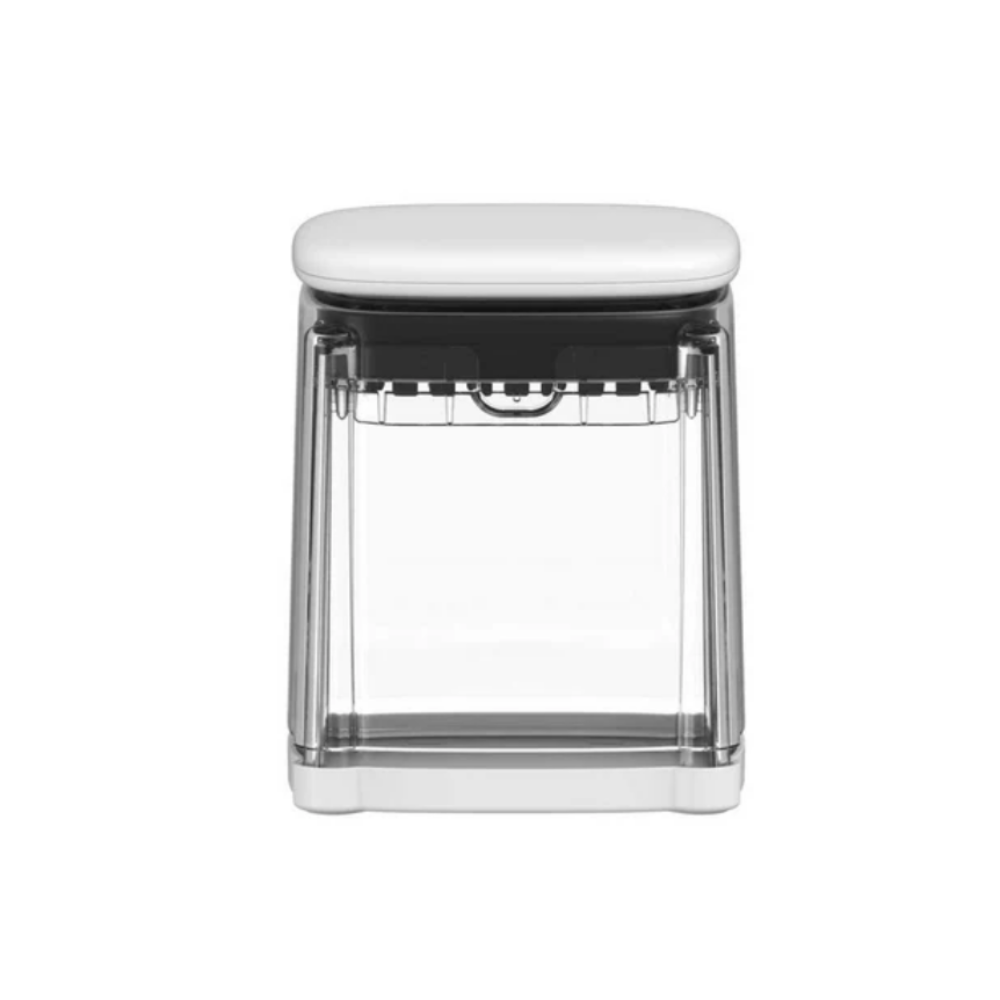 A modern kitchen chopper with a white cushioned top, a clear transparent body, and a black inner mechanism, shown against a plain white background.