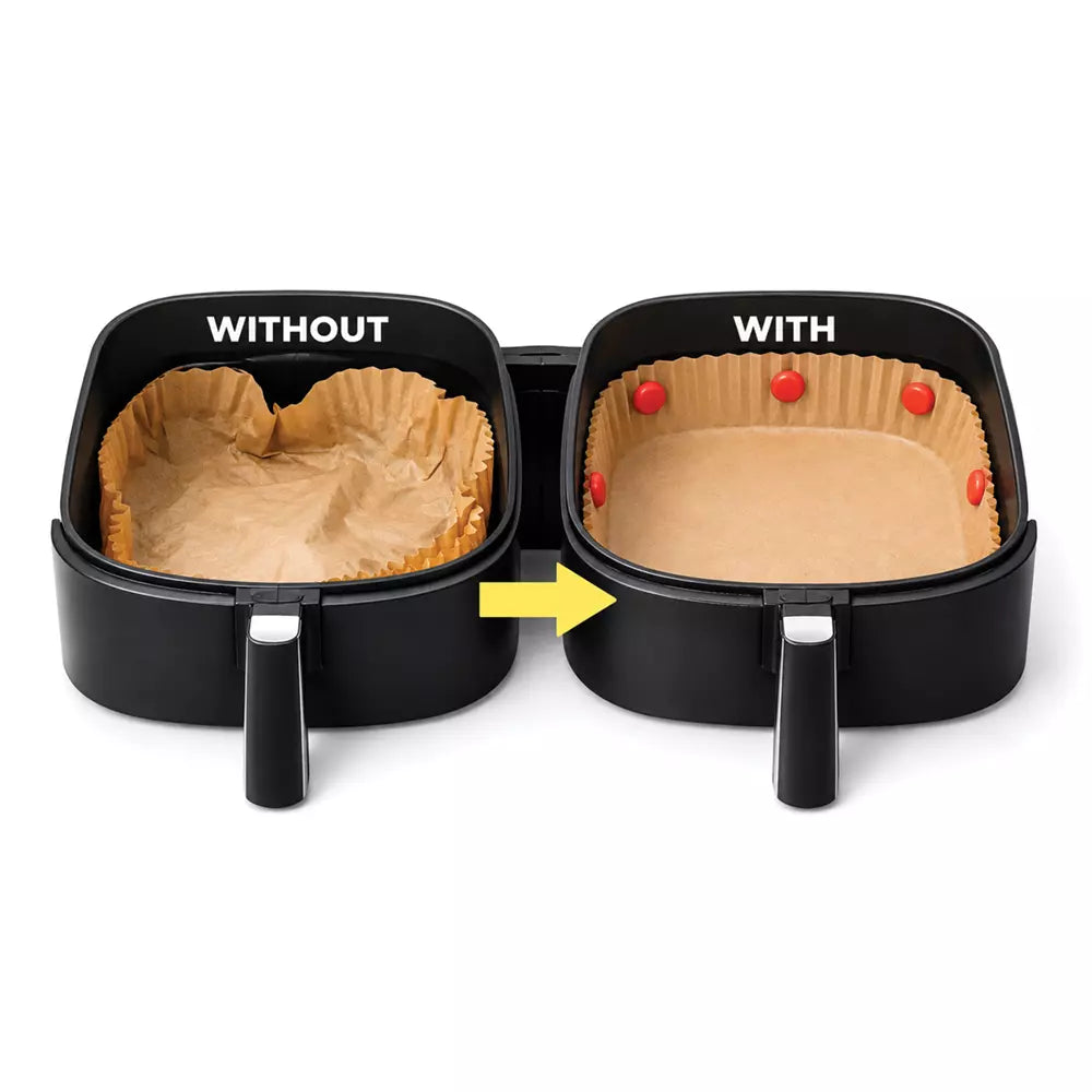 Two black air fryer baskets shown side by side on a white background, labeled 'WITHOUT' and 'WITH' to demonstrate liner placement. The left basket is empty inside, while the right basket shows a tan paper liner fitted with small red clips.