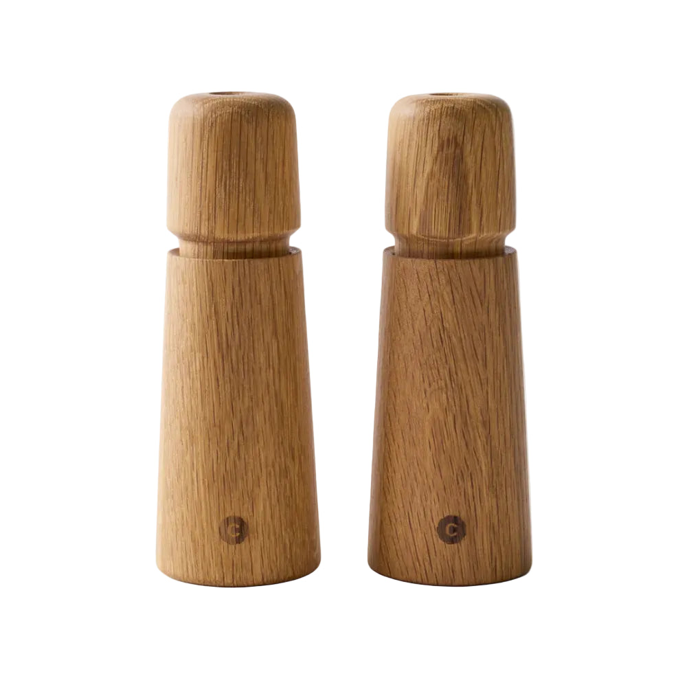 Set of salt and pepper grinders with a white background