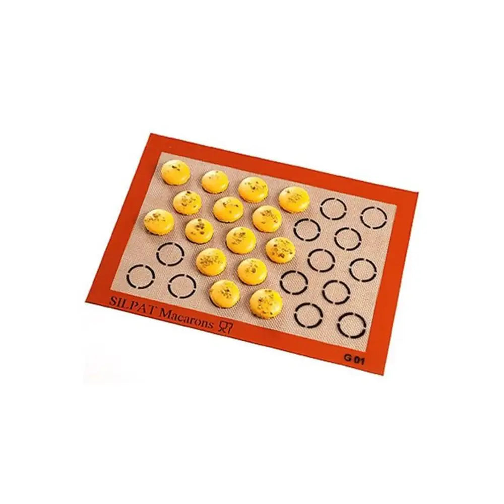 Silicone mat with macaron shells on a white background