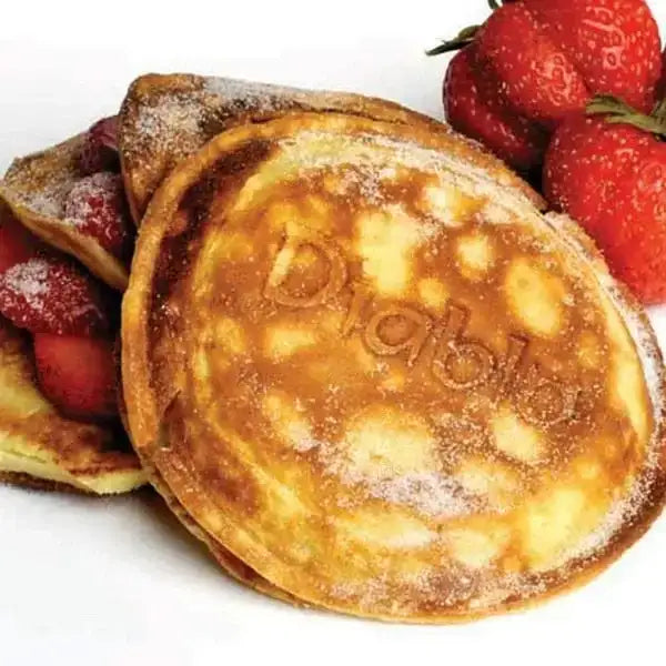 Golden jaffle with Diablo branding, topped with icing sugar and fresh strawberries, Cookin Stores