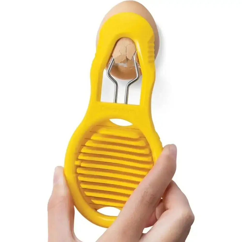 Yellow egg slicer held by a hand on a white background